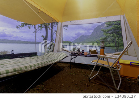 Camping tent, view from inside the tent to see the view outside the mountain, forest, lake, camping tent on a high mountain 134380127