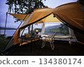 Camping tent, view from inside the tent to see the view outside the mountain, forest, lake, camping tent on a high mountain 134380174
