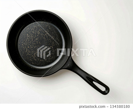 Contemporary design.  Cast iron pan. Kitchenware on white background. Top view. 134380180