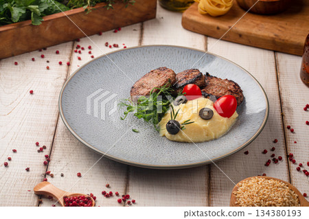 Grilled beef medallions with mashed potatoes Grilled beef medallions with mashed potatoes 134380193