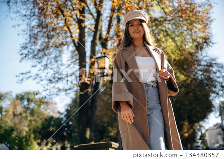 Having a walk. Beautiful woman is outdoors in the town Having a walk. Beautiful woman is outdoors in the town 134380357