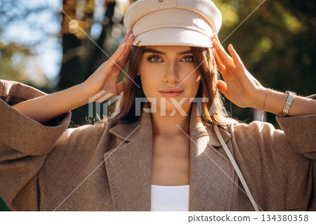 Beautiful woman is outdoors in the town Beautiful woman is outdoors in the town 134380358