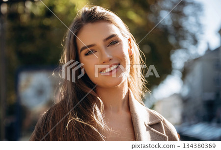 Portrait of beautiful woman that is outdoors in the town 134380369