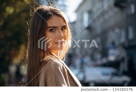 Focused portrait. Beautiful woman is outdoors in the town 134380376