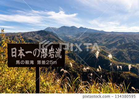The majestic Mt. Ontake with autumn foliage and the lava flow observation deck 134380595