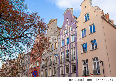 Colorful buildings in a European street with clear blue sky in Gdansk, Poland Colorful buildings in a European street with clear blue sky in Gdansk, Poland 134380735