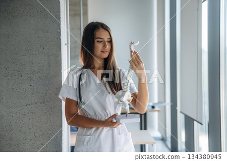 Professional female doctor in the clinic indoors Professional female doctor in the clinic indoors 134380945