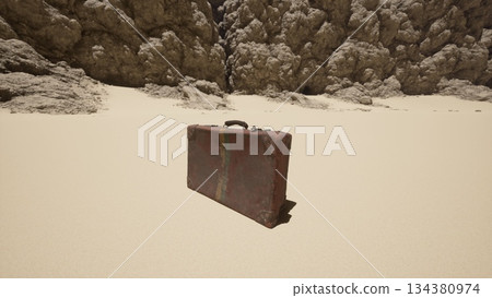 A weathered suitcase stands isolated on the golden sands of a vast desert. The rocky cliffs loom nearby, creating a stark contrast to the soft dunes under the brilliant sunlight. A weathered suitcase stands isolated on the golden sands of a vast desert. The rocky cliffs loom nearby, creating a stark contrast to the soft dunes under the brilliant sunlight. 134380974