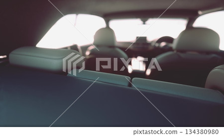 The interior of a stylish car is visible, highlighting comfortable seats and sleek finishes. Sunlight filters in, creating a warm and inviting atmosphere inside the vehicle. The interior of a stylish car is visible, highlighting comfortable seats and sleek finishes. Sunlight filters in, creating a warm and inviting atmosphere inside the vehicle. 134380980