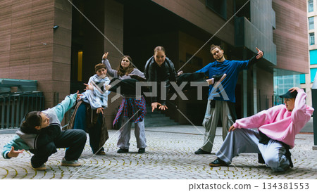 Breakdance group practicing expressive movement in modern city Breakdance group practicing expressive movement in modern city 134381553