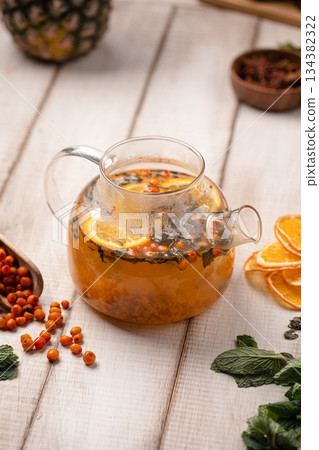 Sea buckthorn tea with citrus slices 134382322