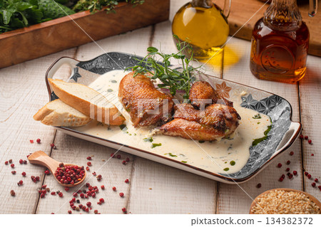 Georgian chkmeruli chicken in creamy garlic sauce Georgian chkmeruli chicken in creamy garlic sauce 134382372