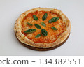 Neapolitan pizza margherita with tomatoes and cheese mozzarella on wooden board on white background 134382551