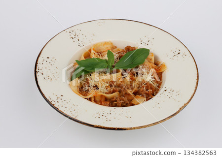 Pasta Bolognese with tomato sauce in white bowl on a white background 134382563
