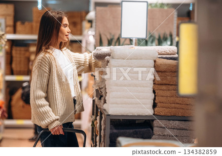 Woman is in the shop with decoration, indoors 134382859