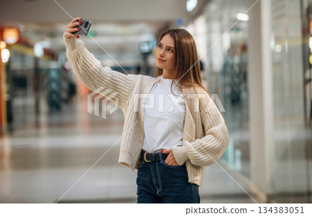 Making a selfie. Beautiful woman is in the mall, conception of shopping 134383051
