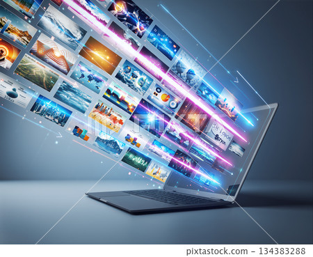 Creative display of images flowing from a laptop in a modern digital workspace Creative display of images flowing from a laptop in a modern digital workspace 134383288