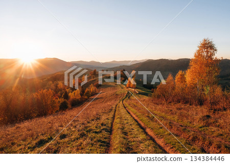 Sun is over horizon. Majestic view of Carpathian mountains, autumn season Sun is over horizon. Majestic view of Carpathian mountains, autumn season 134384446