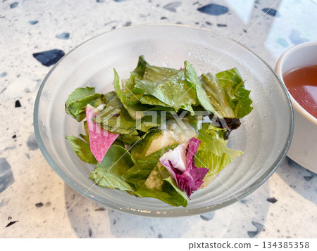 A salad featuring red radish; a colorful salad with a vibrant pink color. A salad featuring red radish; a colorful salad with a vibrant pink color. 134385358