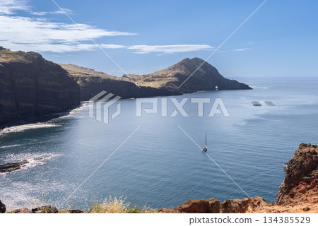 Rugged Sao Lourenco coastline in Madeira bathed in clear Atlantic light with red cliffs Rugged Sao Lourenco coastline in Madeira bathed in clear Atlantic light with red cliffs 134385529