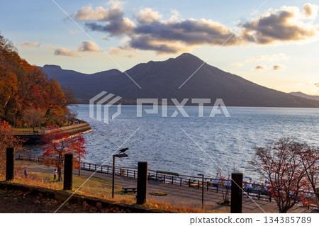 Lake Shikotsu and Mount Fuppushi in autumn, dyed by the setting sun Lake Shikotsu and Mount Fuppushi in autumn, dyed by the setting sun 134385789
