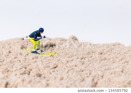 Conceptual Skiing Idea on White Background Conceptual Skiing Idea on White Background 134385792