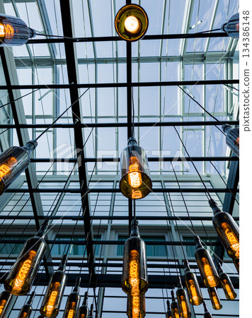 glass chandeliers in the shape of a bottle 134386148