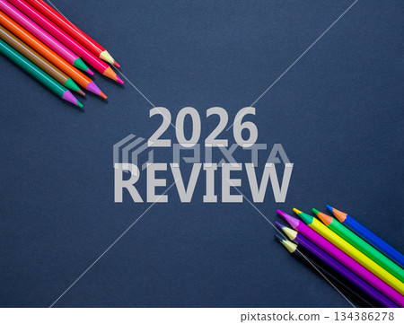 2026 Review symbol. Concept words 2026 Review on beautiful black paper. Beautiful black paper background. Beautiful colored pencils. Business and 2026 review concept. Copy space. 134386278