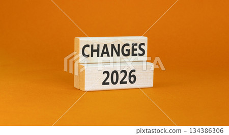 Changes 2026 symbol. Concept words Changes 2026 on beautiful wooden blocks. Beautiful orange paper background. Business and changes 2026 concept. Copy space. Changes 2026 symbol. Concept words Changes 2026 on beautiful wooden blocks. Beautiful orange paper background. Business and changes 2026 concept. Copy space. 134386306