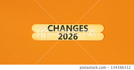 Changes 2026 symbol. Concept words Changes 2026 on beautiful wooden sticks. Beautiful orange paper background. Business and changes 2026 concept. Copy space. Changes 2026 symbol. Concept words Changes 2026 on beautiful wooden sticks. Beautiful orange paper background. Business and changes 2026 concept. Copy space. 134386312
