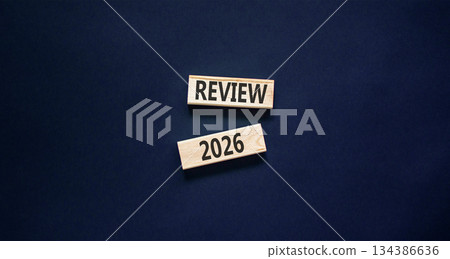 Review 2026 symbol. Concept words Review 2026 on beautiful wooden blocks. Beautiful black paper background. Business and review 2026 concept. Copy space. 134386636