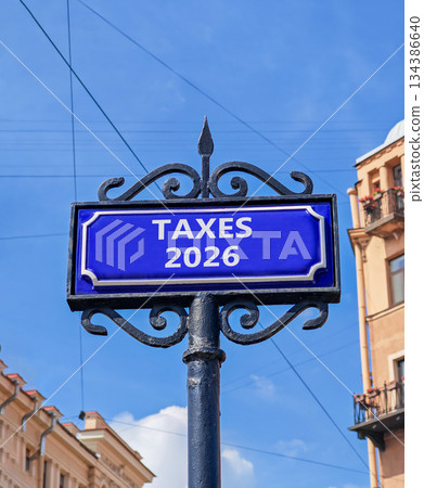 Taxes 2026 new year symbol. Concept words Taxes 2026 on beautiful blue road sign. Beautiful blue sky and buildings background. Business and taxes 2026 new year concept. Copy space. Taxes 2026 new year symbol. Concept words Taxes 2026 on beautiful blue road sign. Beautiful blue sky and buildings background. Business and taxes 2026 new year concept. Copy space. 134386640