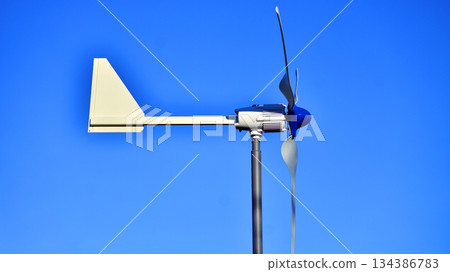Wind turbine on blue sky. Concept of clean energy. Green technology for future.  134386783