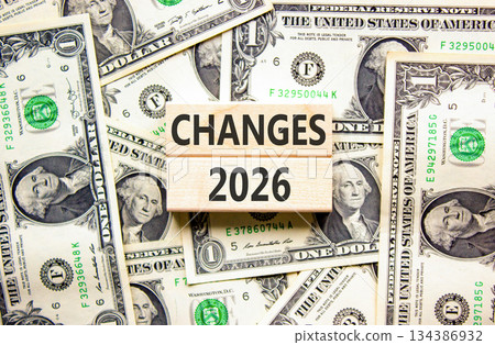 Changes 2026 symbol. Concept words Changes 2026 on beautiful wooden blocks. Beautiful dollar bills background. Dollar bills. Business and changes 2026 concept. Copy space. Changes 2026 symbol. Concept words Changes 2026 on beautiful wooden blocks. Beautiful dollar bills background. Dollar bills. Business and changes 2026 concept. Copy space. 134386932