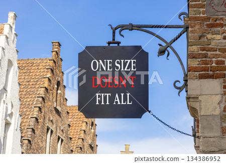 One size does not fit all symbol. Concept words One size does not fit all on black beautiful road sign. Beautiful blue sky buildings background. Business one size does not fit all concept. Copy space. One size does not fit all symbol. Concept words One size does not fit all on black beautiful road sign. Beautiful blue sky buildings background. Business one size does not fit all concept. Copy space. 134386952