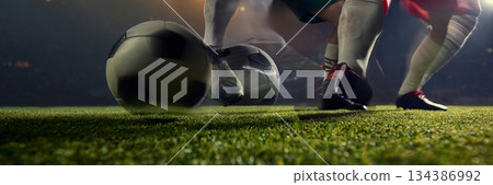 Football dribbling action with motion blur and close ball control on grass pitch. Banner Football dribbling action with motion blur and close ball control on grass pitch. Banner 134386992