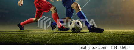 Explosive football players movements near ball. Banner 134386994