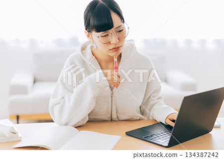 Women studying online Women studying online 134387242