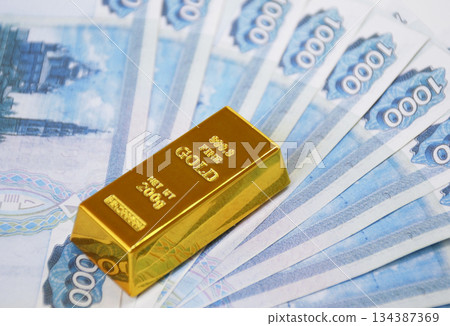 Russian rubles with a gold ingot. Russian financial system backed by gold Russian rubles with a gold ingot. Russian financial system backed by gold 134387369