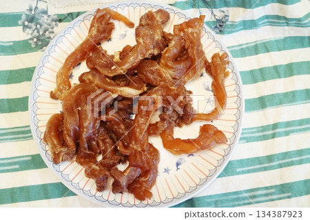 A plate of pork on the tablecloth A plate of pork on the tablecloth 134387923