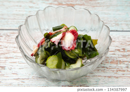 Vinegared octopus, cucumber and wakame seaweed 134387997