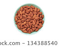 Almonds in mint bowl isolated on white background 134388540