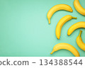 Yellow bananas flat lay on mint background. 134388544