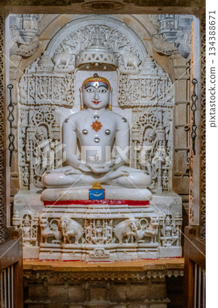 India, Interior of a Jain temple, marble statue of a Jain figure, Tirthankara, seated in meditation posture, lotusIndia, 134388671