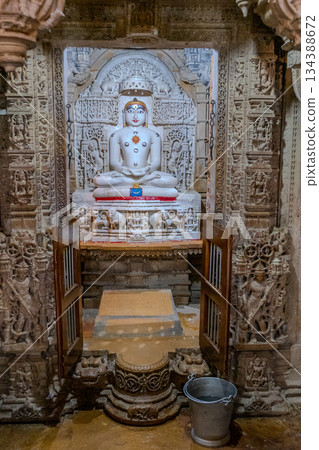India, Interior of a Jain temple, marble statue of a Jain figure, Tirthankara, seated in meditation posture, lotusIndia, 134388672