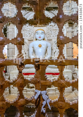 India, Interior of a Jain temple, marble statue of a Jain figure, Tirthankara, seated in meditation posture, lotusIndia, India, Interior of a Jain temple, marble statue of a Jain figure, Tirthankara, seated in meditation posture, lotusIndia, 134388673