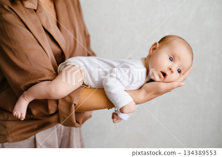 Tender Moment Mother Holding Newborn Tender Moment Mother Holding Newborn 134389553