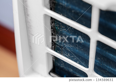 Dust accumulation on internal cooling coil of household climate control device indoor 134389631