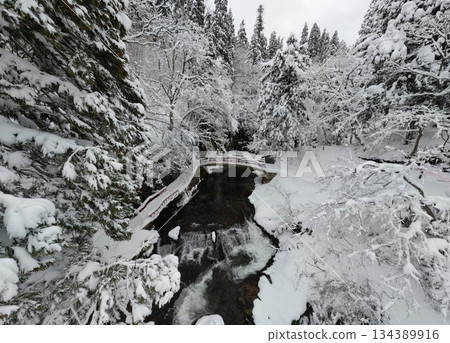 Snow scene at Shirogane Falls Snow scene at Shirogane Falls 134389916