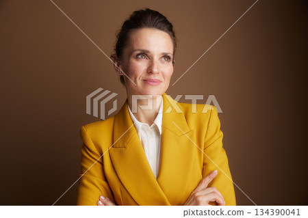 Confident Businesswoman with Subtle Smile and Crossed Arms 134390041